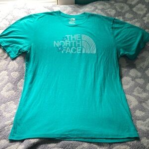 The North Face | teal short sleeve t-shirt with flower graphics